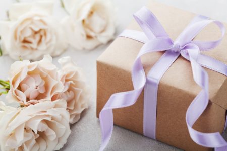 wrapped wedding gift with purple ribbon