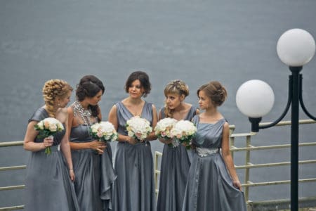 Gray bridesmaids' dresses in varying styles