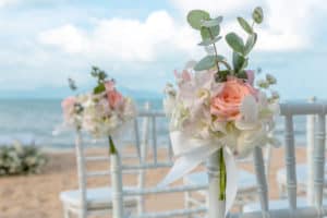 Flower decor on wedding chairs
