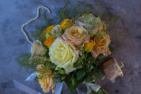 Victorian style bride bouquet with peach, pink, and ivory rose
