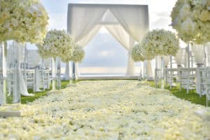 Elegant white flower petal wedding aisle and white flower aisle markers