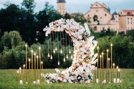 Moon shaped floral installation for outside wedding flower display