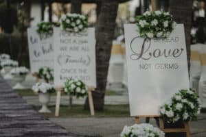 White wedding signs with flower accents