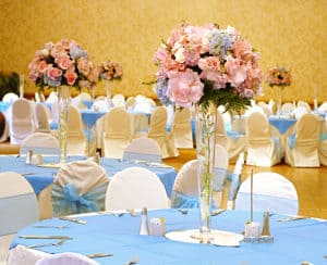 Pastel pink and blue flower centerpieces and decor for a gender reveal party