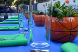 Blue and Green table cloths with basketball centerpieces
