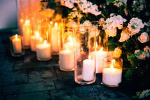 Night wedding ceremony decoration with candles and flowers on background