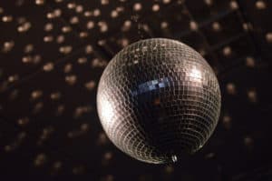 Disco Ball spinning under the shiny lights, beautiful lights for dancing and wedding party