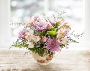 Bouquet of colorful flowers arranged in small vase