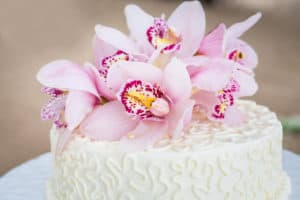 Beautiful of Wedding Cake with Flowers on Top.