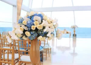 Simple and modern indoor island wedding with blue and white flowers