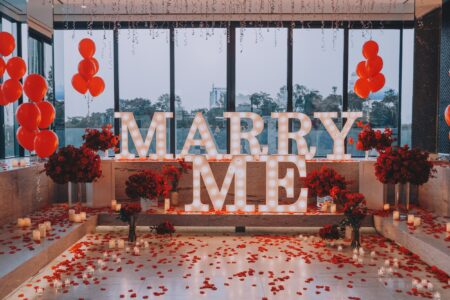 Marry me backdrop proposal engagement event flowers rice balloons candles petals