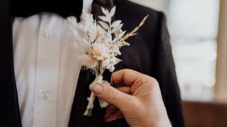 Black suit and white boutonniere