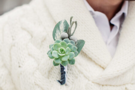 White sweater and succulent boutonniere